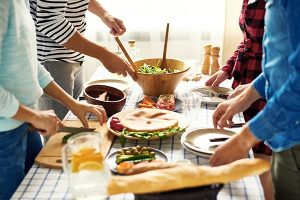 Food on table with people